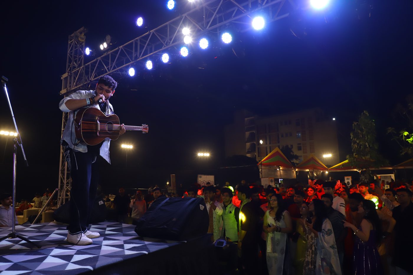 Performer under stage lights